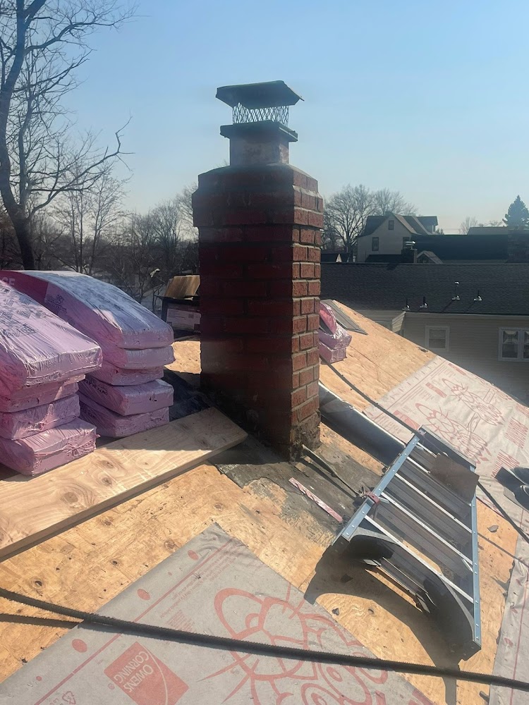 Top Pros Construction INC offering chimney services in Garfield