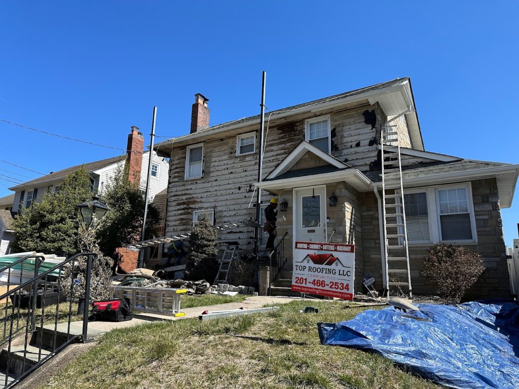 Top Roofing LLC offering chimney services in Garfield
